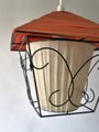 Orange retro pendant lamp with white inner shade and black metal frame