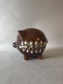 Brown vintage ceramic piggy bank with white floral decorations, made by Gmundner Keramik Austria
