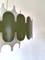 Green and white vintage metal pendant light with layered design and soft light effect