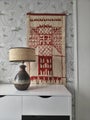 Finnish 1960s&ndash;70s vintage woven wall tapestry in off-white and brick red with geometric architectural pattern.
