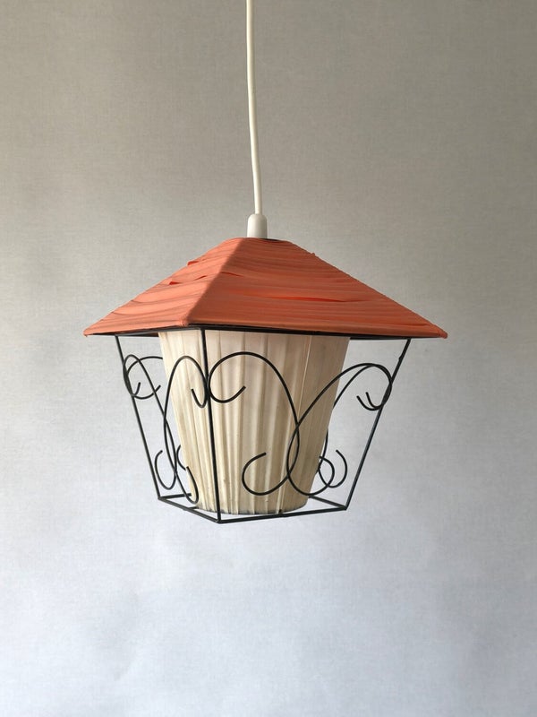 Orange retro pendant lamp with white inner shade and black metal frame