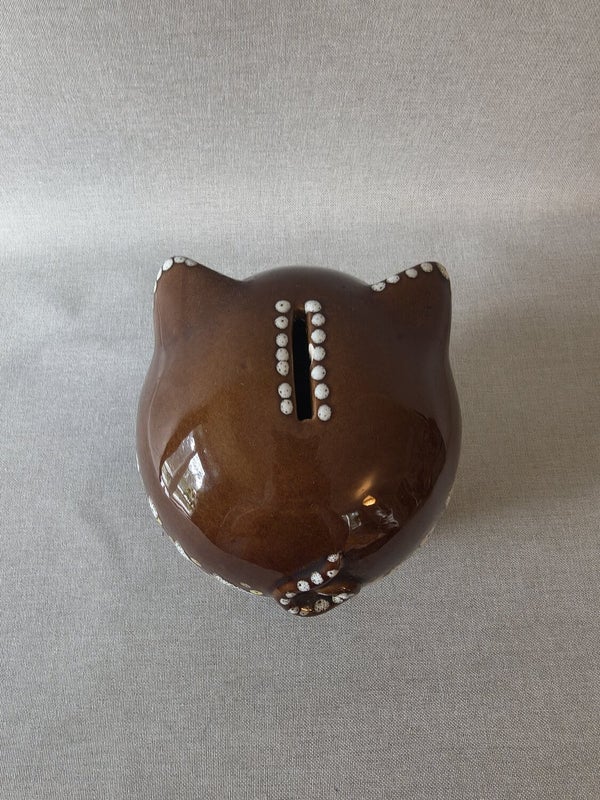 Brown vintage ceramic piggy bank with white floral decorations, made by Gmundner Keramik Austria