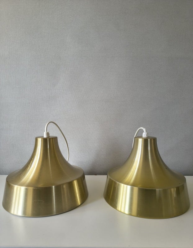 Two gold vintage pendant lamps with conical shape and polished metal surface